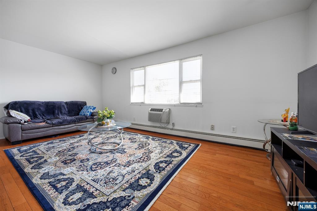747 Riverside Avenue, Unit C1 Lyndhurst, NJ 07071 - Photo 5 of 16 a living room with a rug