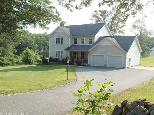 a front view of house with garden