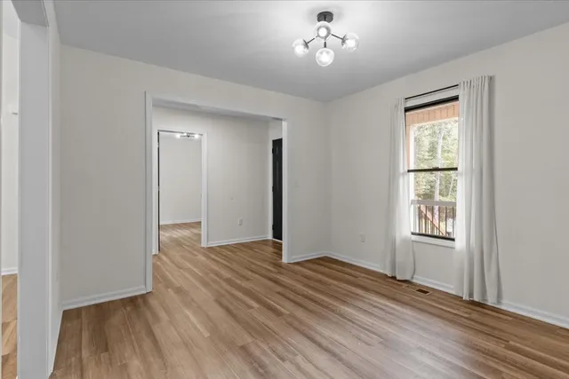 a view of entryway with wooden floor