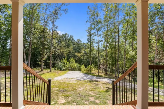 a view of a garden from a balcony