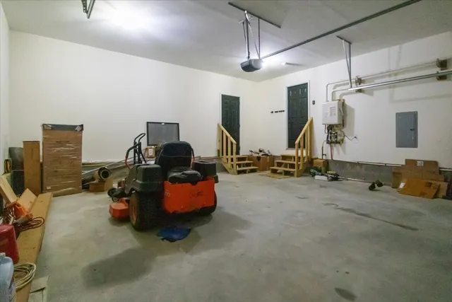 a front view of a house with a yard and trees