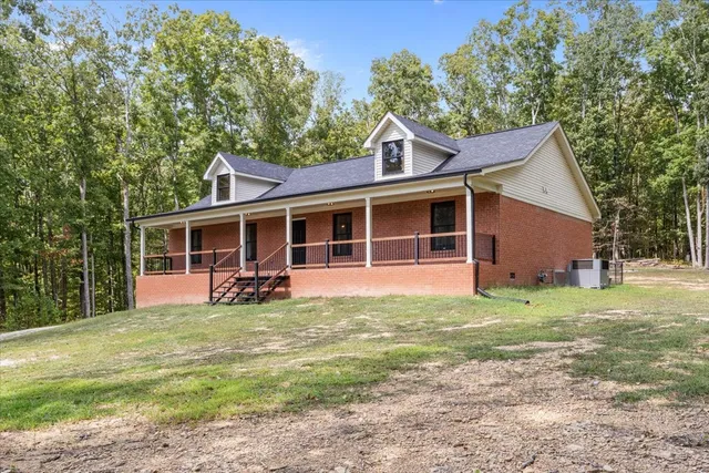 a house with trees in the background