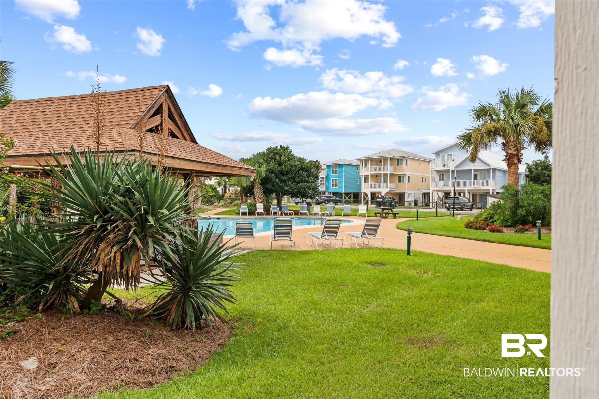 497 Plantation Road, Unit 1164 Gulf Shores, AL 36542 - Photo 4 of 20 View of yard with a community pool