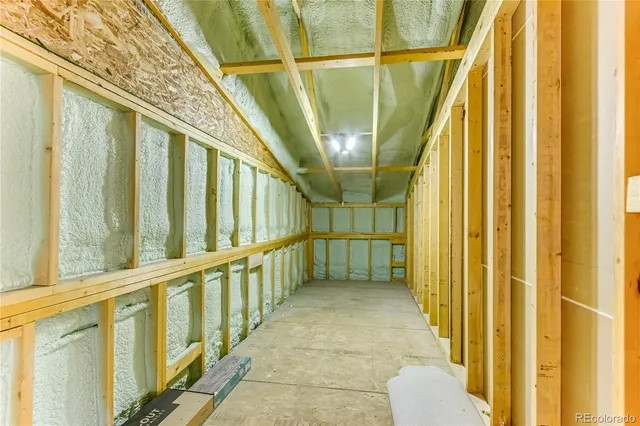 a bathroom with a granite countertop sink a toilet a mirror and shower
