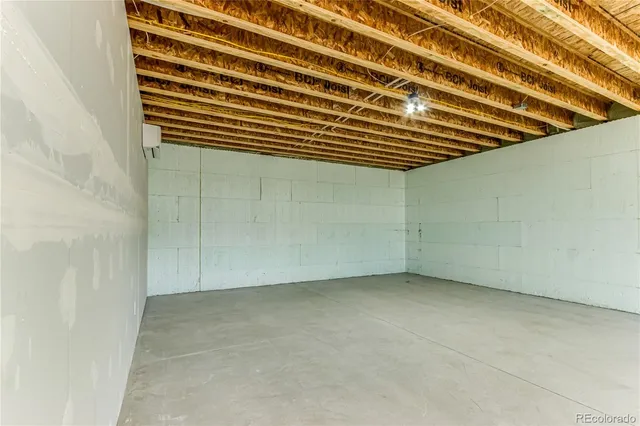 a view of a gallery with wooden floor