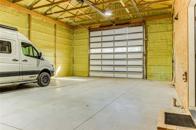 an aerial view of houses covered in trees