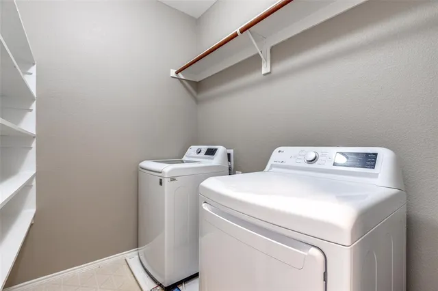 a kitchen with stainless steel appliances granite countertop a refrigerator stove top oven a sink and dishwasher