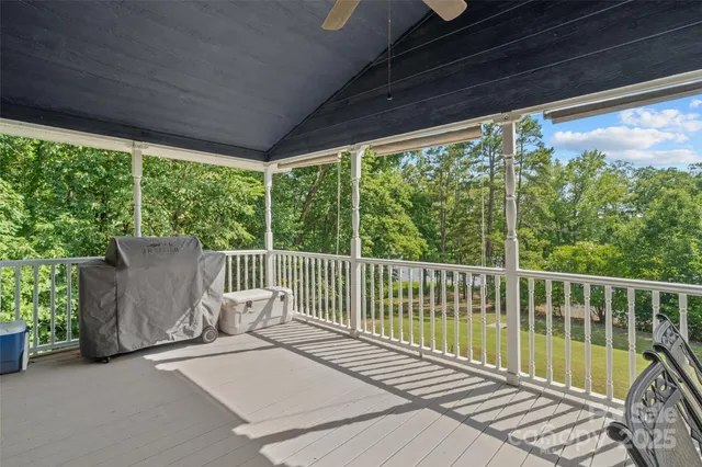 a view of a chair and table in the balcony