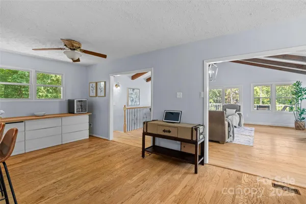 a bedroom with furniture and a window
