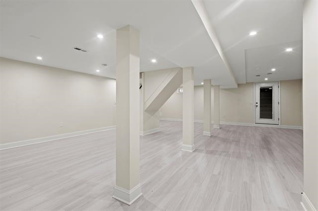 238 Springfield Avenue, Unit 1 Rutherford, NJ 07070 - Photo 14 of 33 an empty room with wooden floor and a kitchen