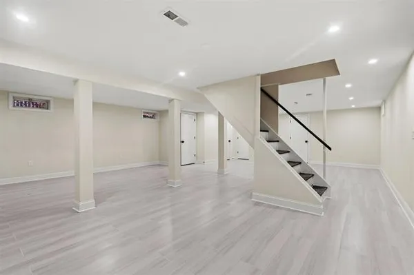 a view of an entryway with wooden floor