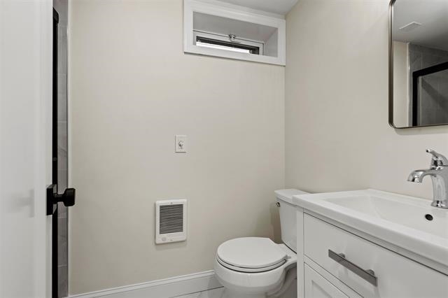 238 Springfield Avenue, Unit 1 Rutherford, NJ 07070 - Photo 17 of 33 a bathroom with a sink toilet and vanity