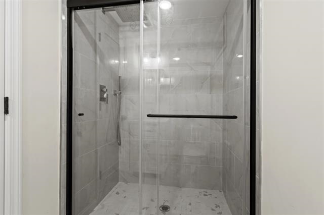 238 Springfield Avenue, Unit 1 Rutherford, NJ 07070 - Photo 18 of 33 a bathroom with a glass shower door