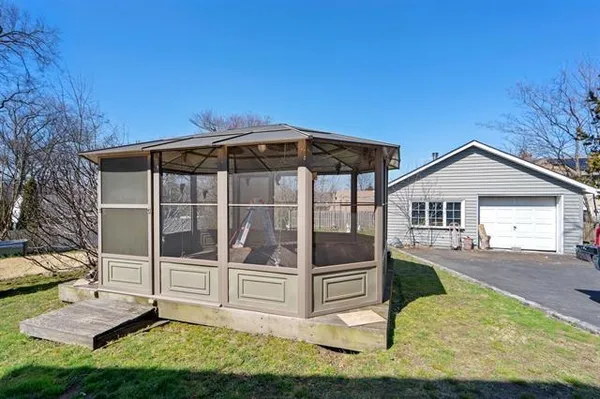 a view of house with yard in front of it