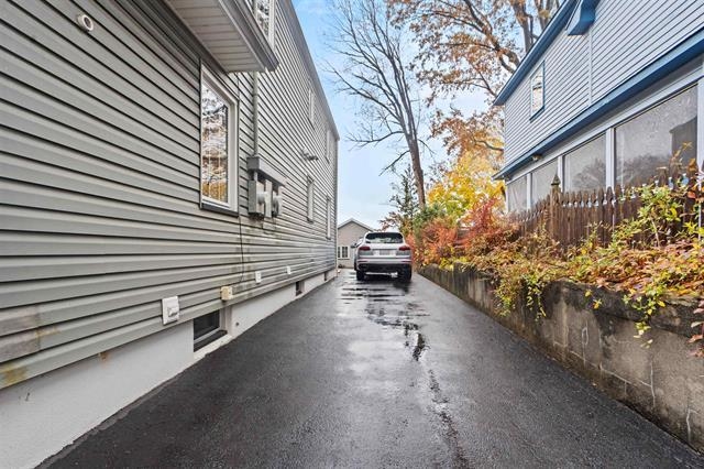 238 Springfield Avenue, Unit 1 Rutherford, NJ 07070 - Photo 25 of 33 a view of a house with a yard and a street