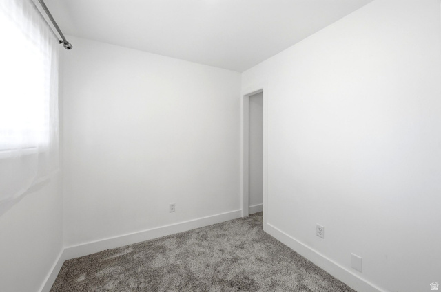 120 North 1230 E Street Springville, UT 84663 - Photo 23 of 60 Compact room featuring neutral white walls and plush gray carpeting