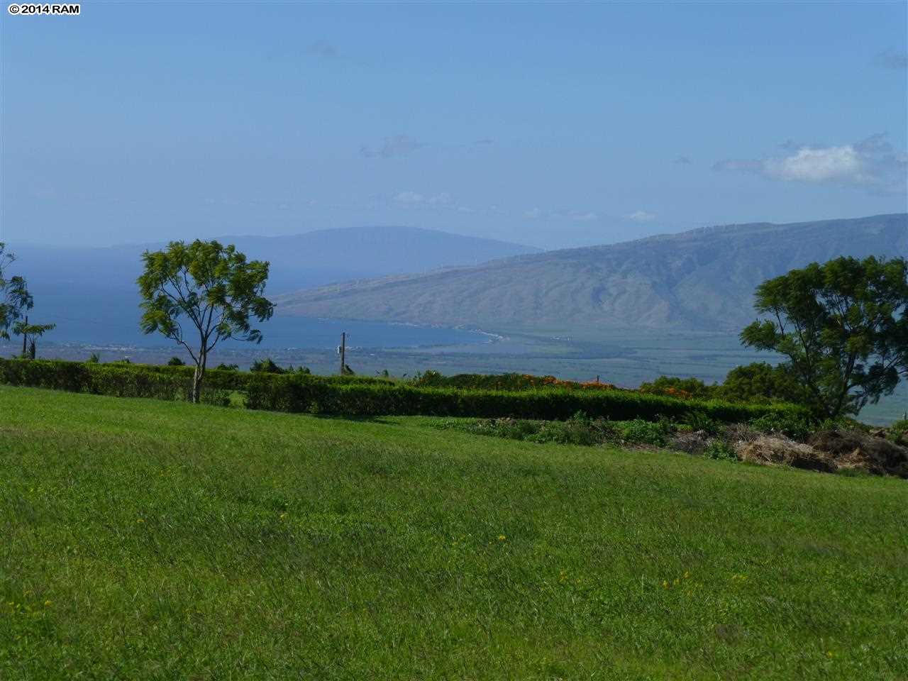 215 B Pulehunui Road Kula, HI 96790 - Photo 17 of 22 a view of a garden with a building in the background