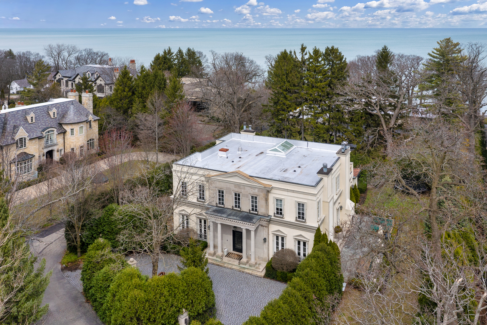 977 Sheridan Road Winnetka, IL 60093 - Photo 3 of 4 an aerial view of a house with a garden and lake view