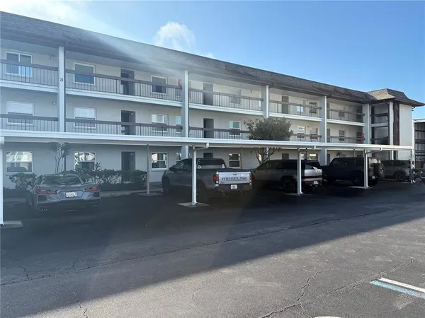 a view of a car park in front of house