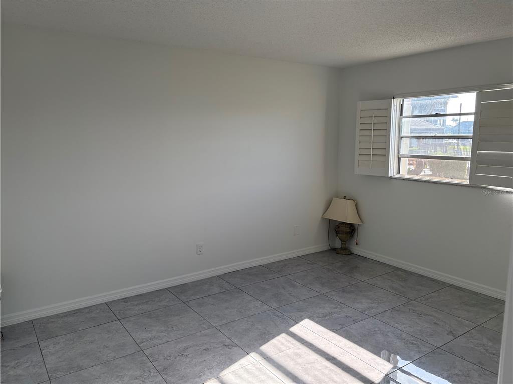 5157 Silent Loop, Unit 115 New Port Richey, FL 34652 - Photo 15 of 18 an empty room with a window