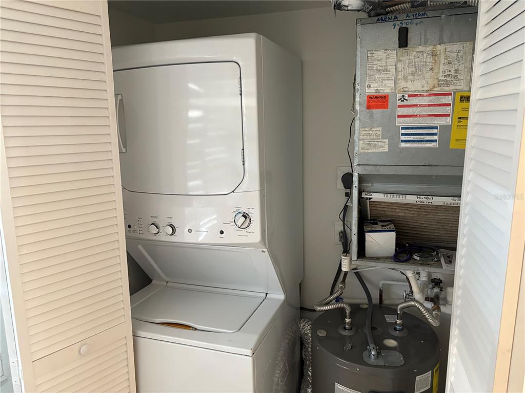 5157 Silent Loop, Unit 115 New Port Richey, FL 34652 - Photo 6 of 18 a utility room with dryer and washer