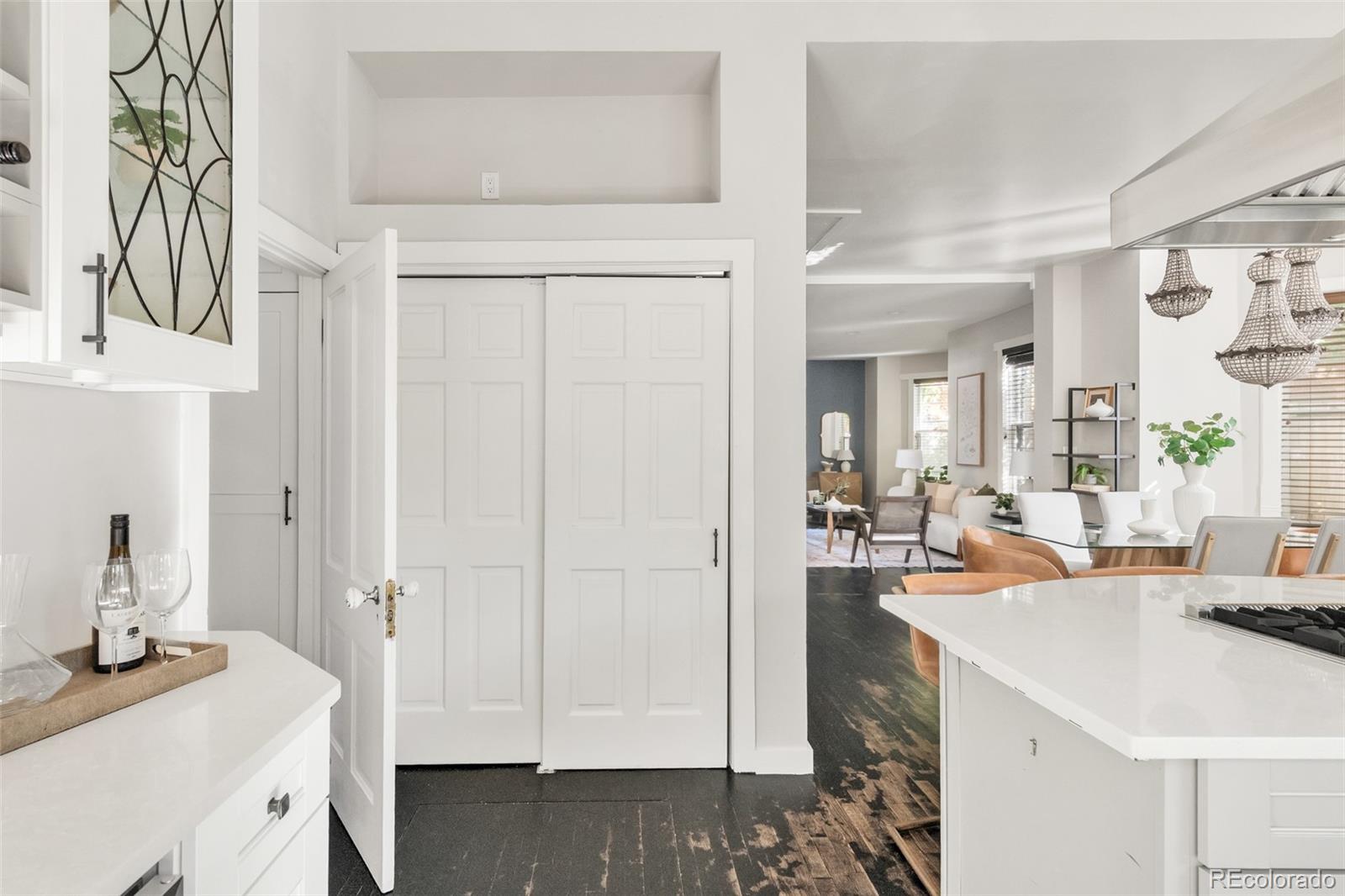 3659 Alcott Street Denver, CO 80211 - Photo 19 of 49 a view of a kitchen area with furniture and wooden floor