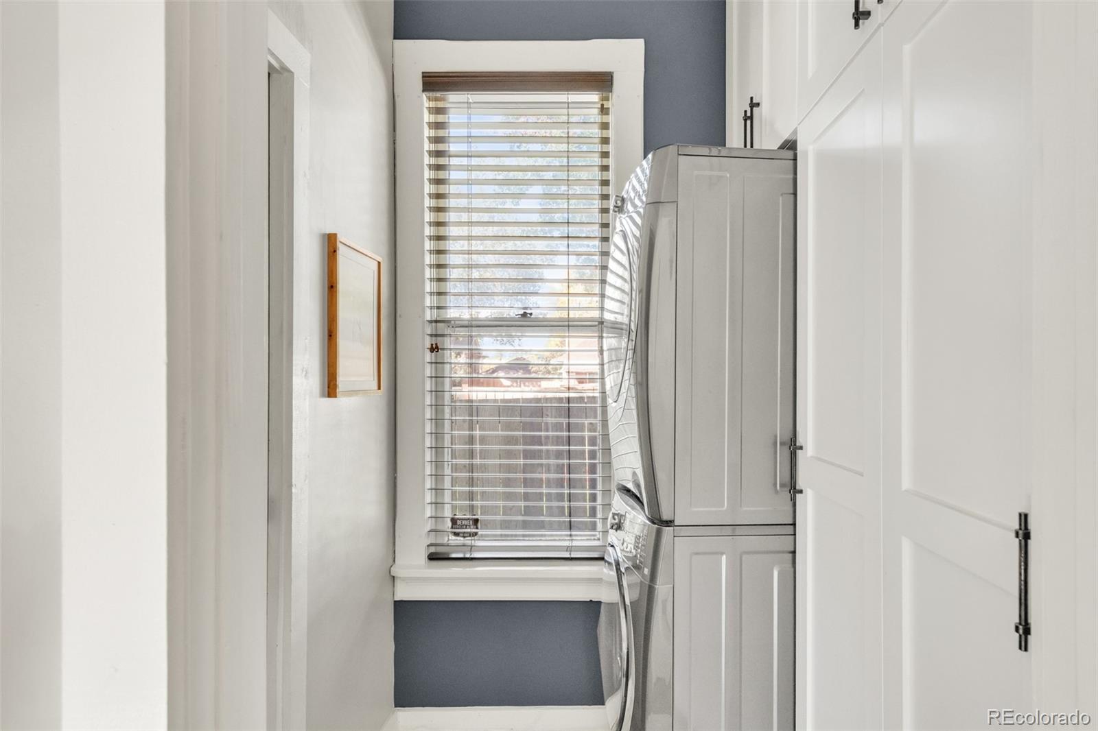 3659 Alcott Street Denver, CO 80211 - Photo 21 of 49 a view of a kitchen with a white wall and a window
