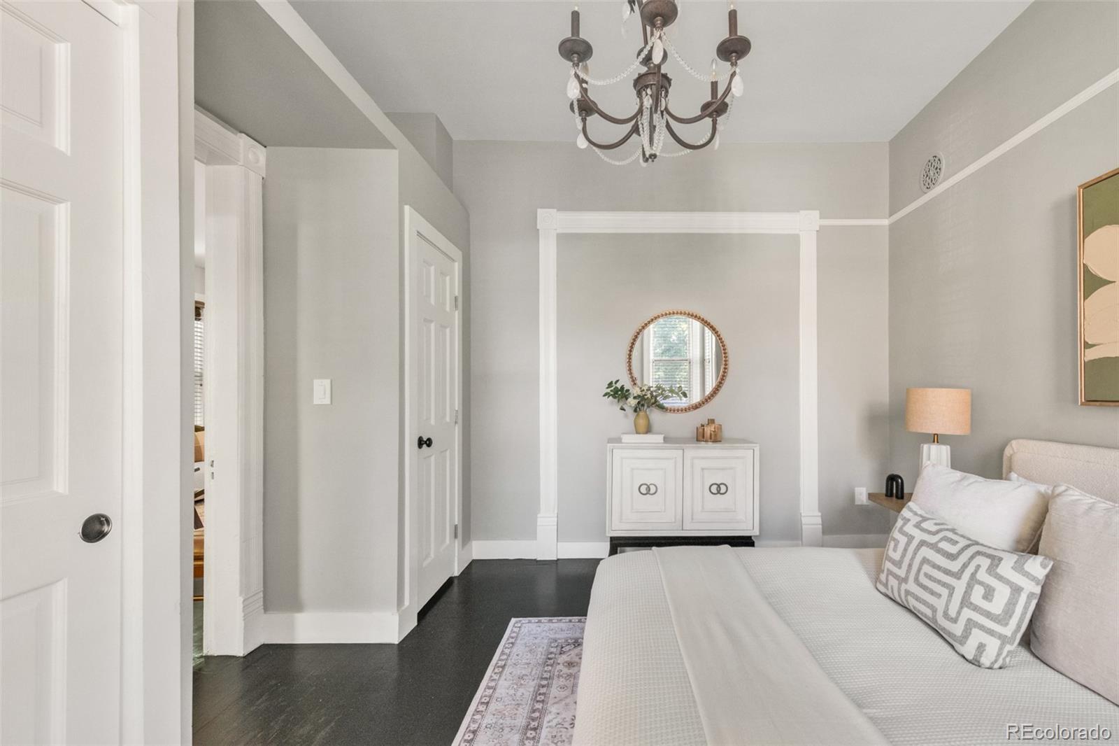 3659 Alcott Street Denver, CO 80211 - Photo 24 of 49 a bedroom with a bed and wooden floor