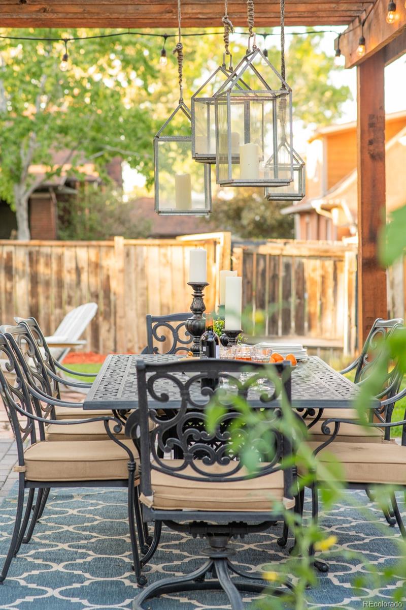 3659 Alcott Street Denver, CO 80211 - Photo 45 of 49 a view of a patio with table and chairs and potted plants