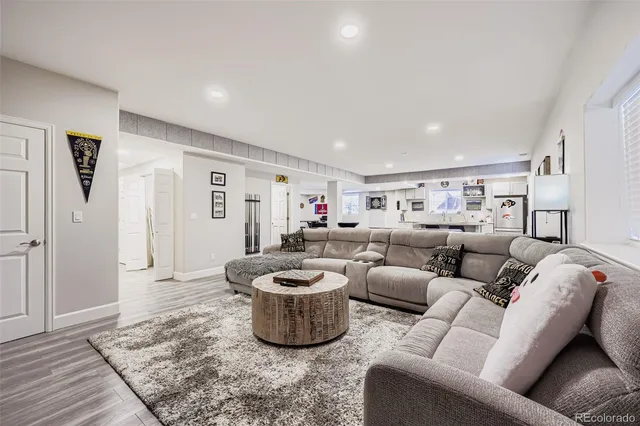 a living room with furniture and a rug