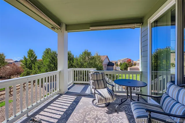a view of a chairs and table in patio