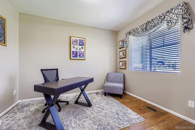 a workspace with furniture and window