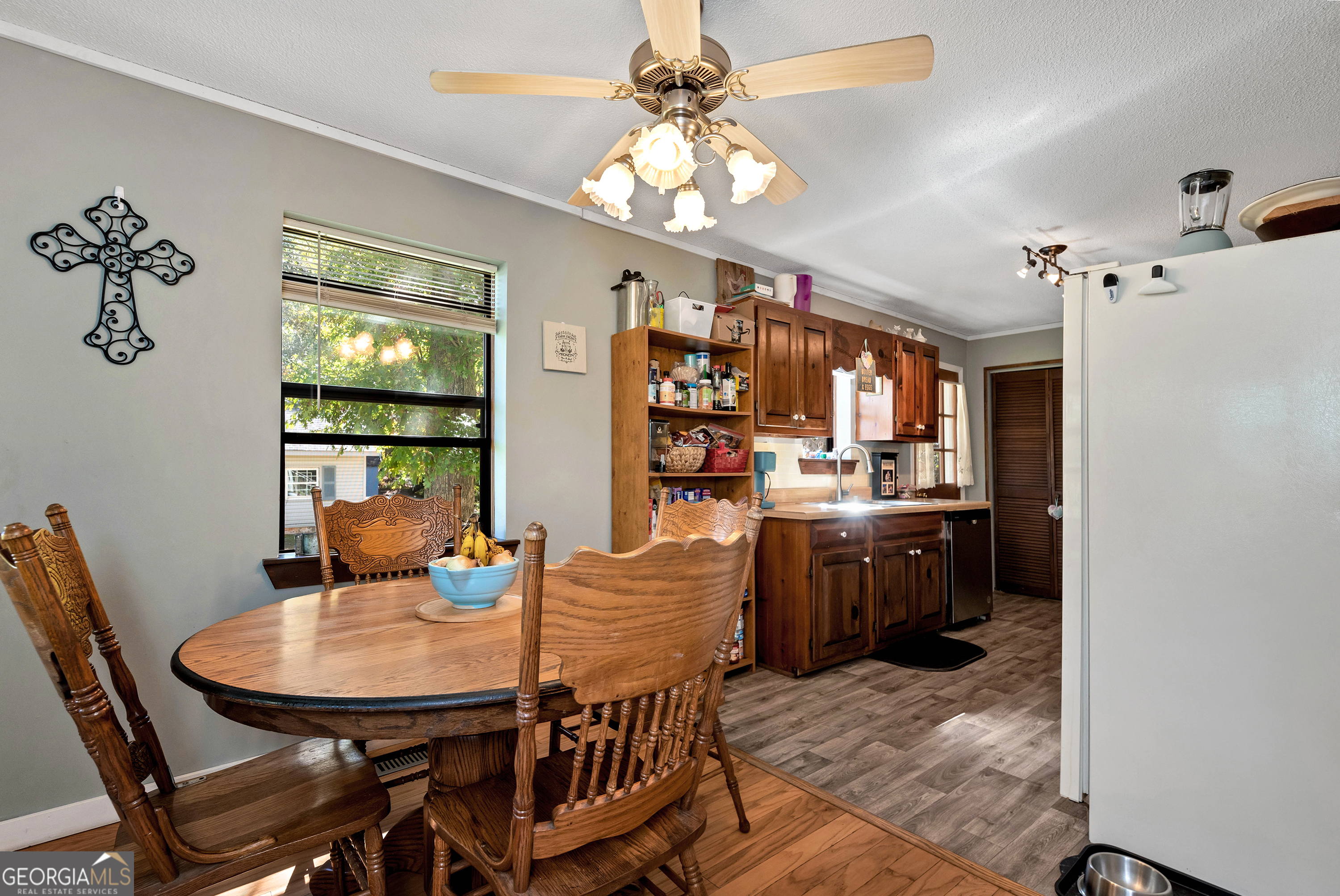 373 Jennys Cove Road Cleveland, GA 30528 - Photo 15 of 44 a view of a dining room with furniture and chandelier