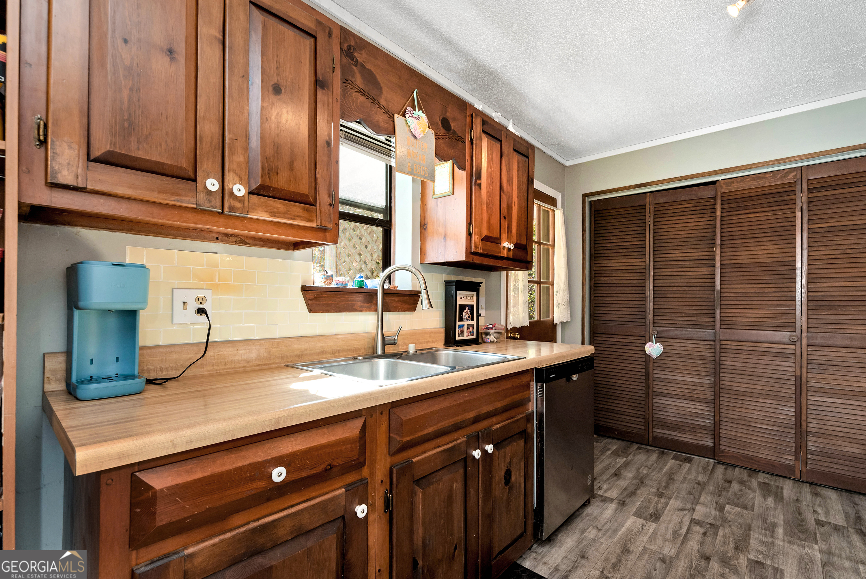 373 Jennys Cove Road Cleveland, GA 30528 - Photo 17 of 44 a kitchen with a sink and cabinets