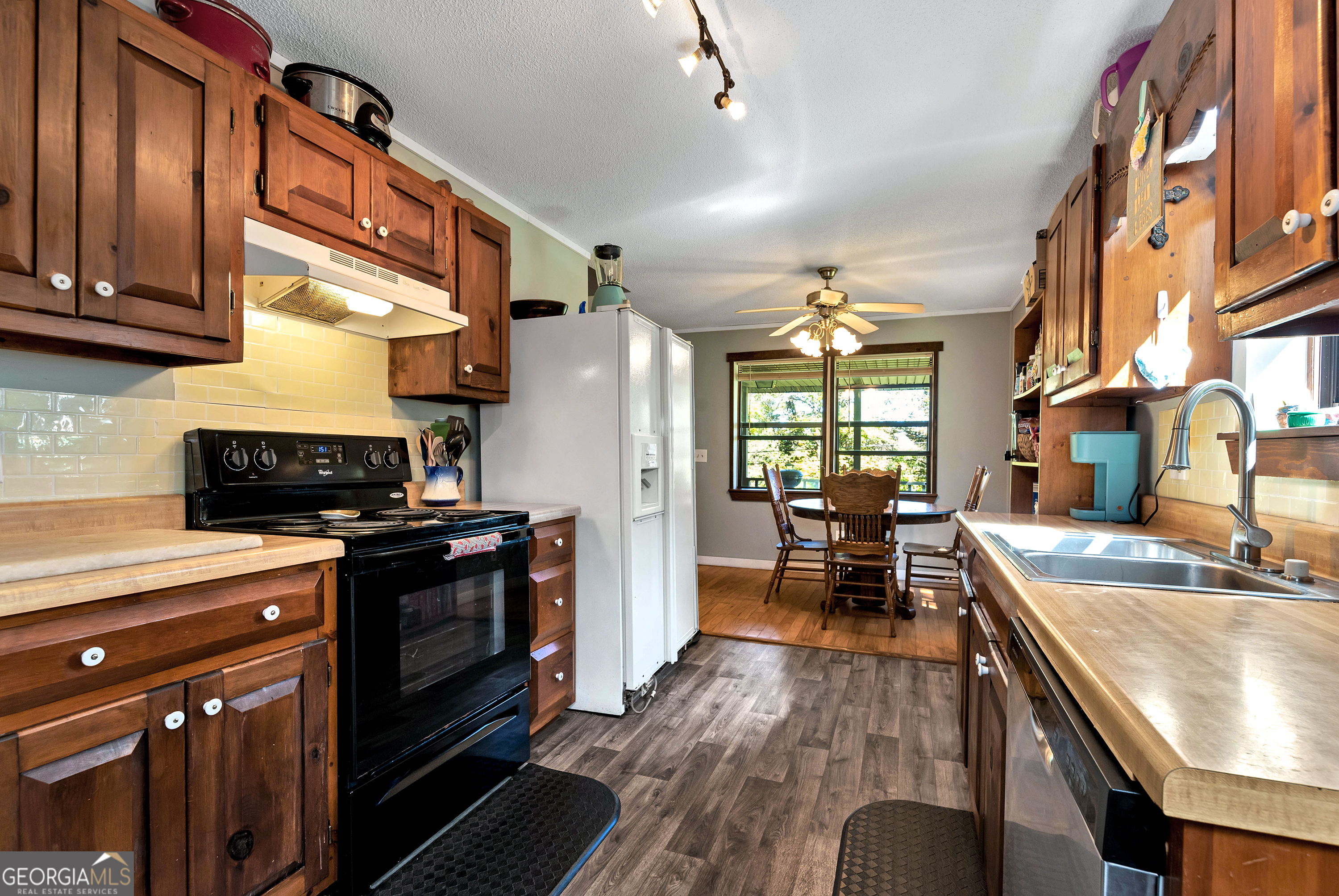 373 Jennys Cove Road Cleveland, GA 30528 - Photo 19 of 44 a kitchen with stainless steel appliances granite countertop a sink stove and refrigerator