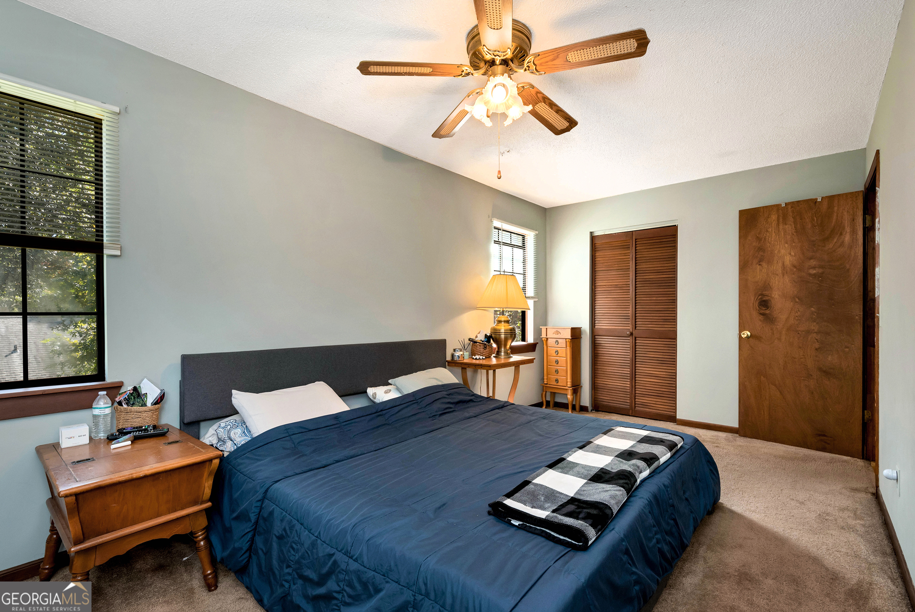 373 Jennys Cove Road Cleveland, GA 30528 - Photo 27 of 44 a bed sitting in a bedroom next to a window