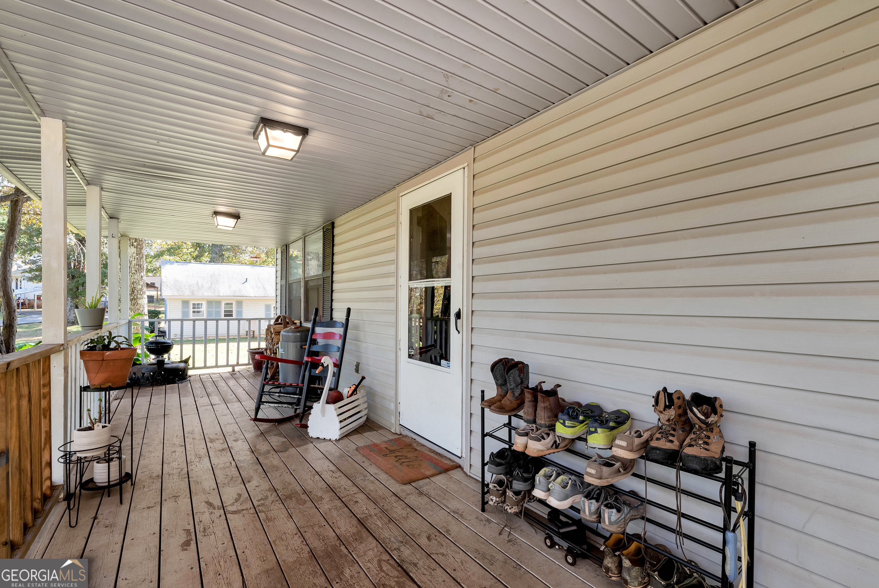373 Jennys Cove Road Cleveland, GA 30528 - Photo 31 of 44 a view of a deck with chairs and potted plants