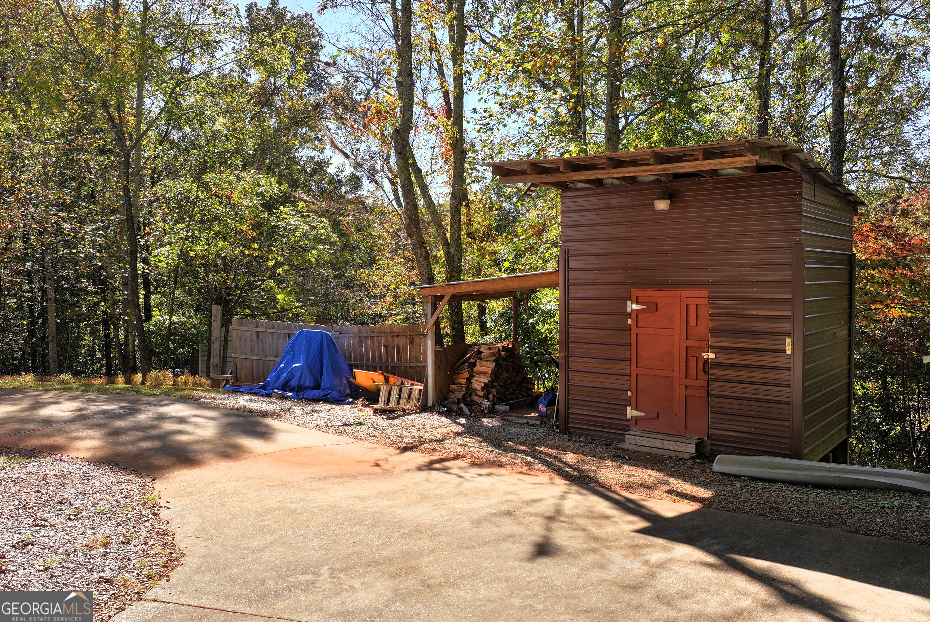 373 Jennys Cove Road Cleveland, GA 30528 - Photo 42 of 44 a view of house with yard and trees in the background