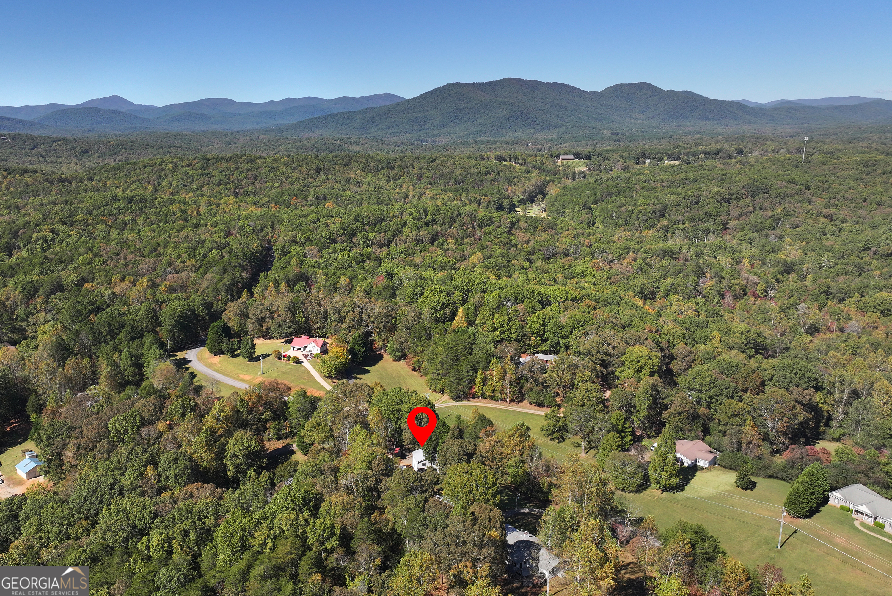 373 Jennys Cove Road Cleveland, GA 30528 - Photo 6 of 44 a view of a lush green hillside and houses