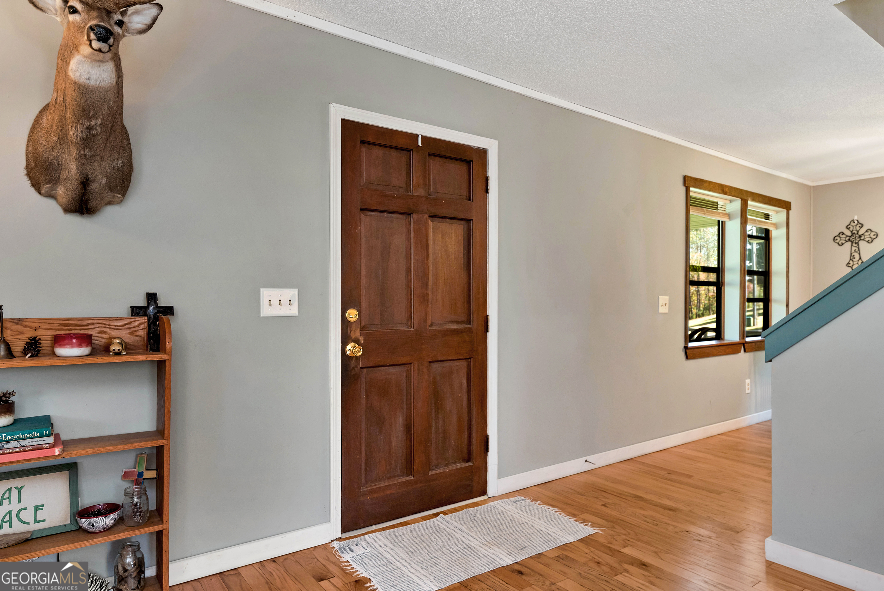 373 Jennys Cove Road Cleveland, GA 30528 - Photo 7 of 44 a view of a hallway with closet and wooden floor