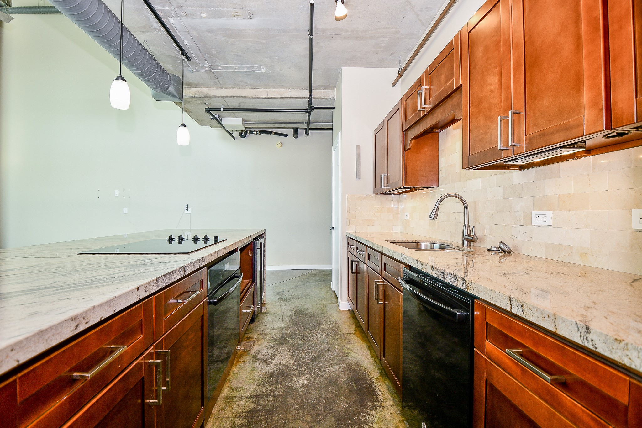 2000 Bagby Street, Unit 5441 Houston, TX 77002 - Photo 13 of 34 a kitchen with stainless steel appliances granite countertop a sink and a stove