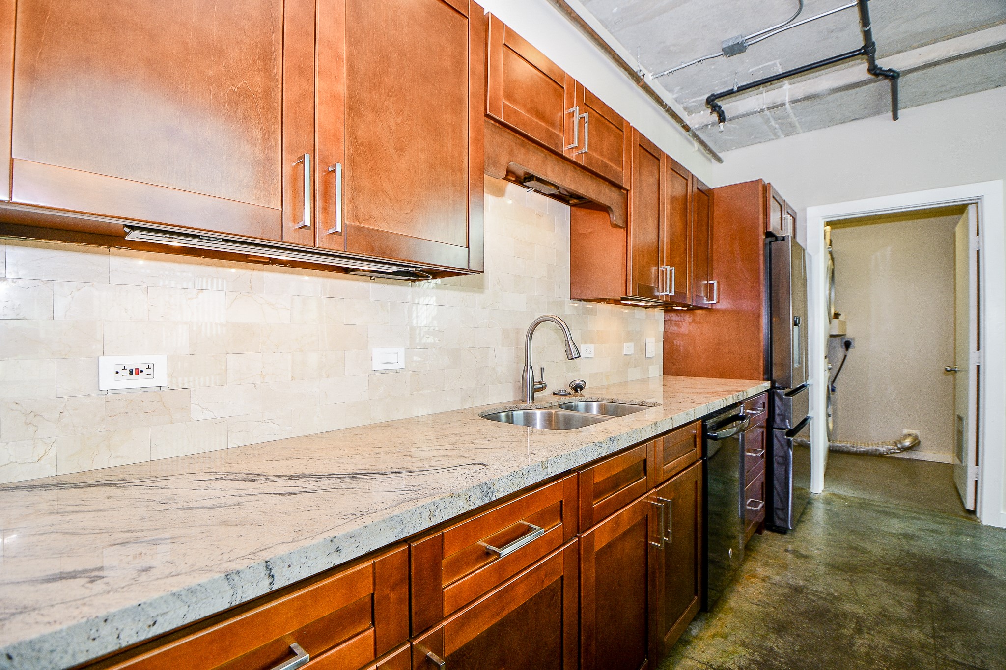 2000 Bagby Street, Unit 5441 Houston, TX 77002 - Photo 16 of 34 a kitchen with stainless steel appliances granite countertop a sink and cabinets