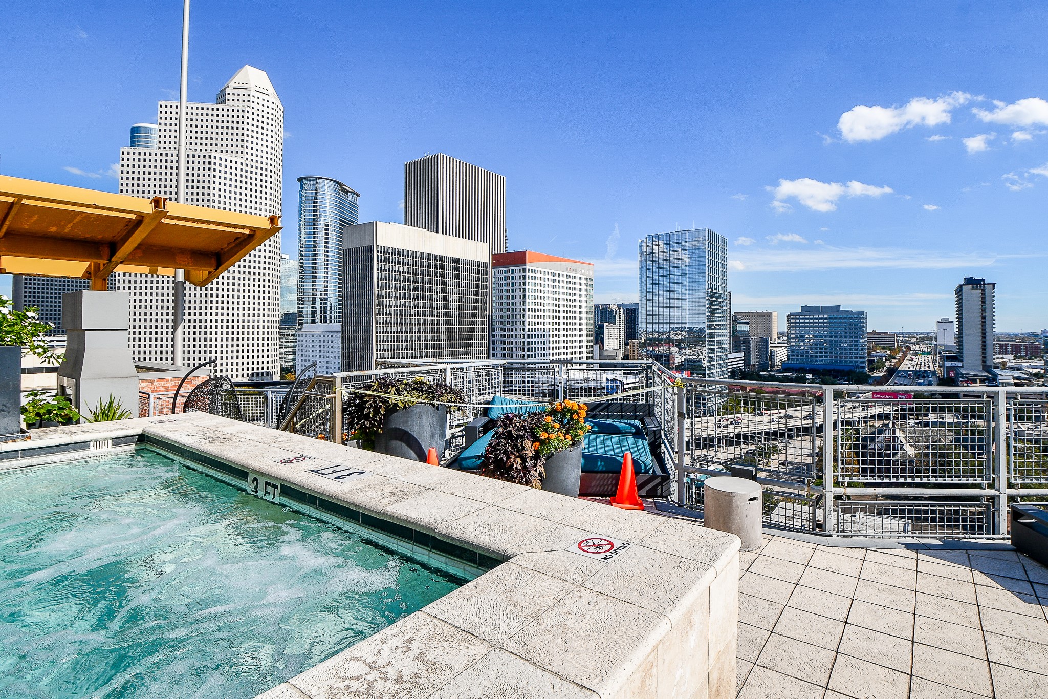 2000 Bagby Street, Unit 5441 Houston, TX 77002 - Photo 2 of 34 a view of roof deck with a barbeque and wooden stairs