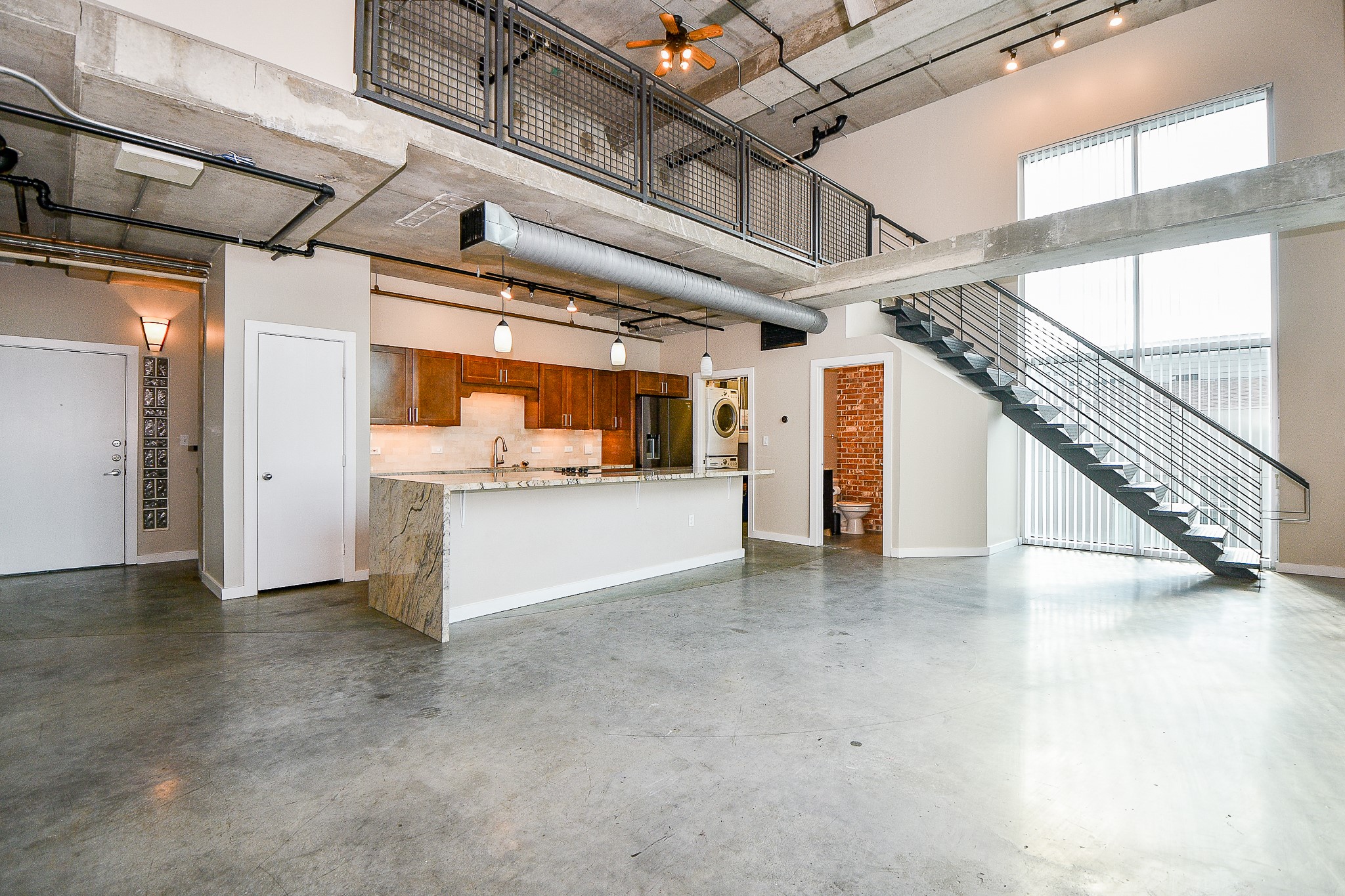 2000 Bagby Street, Unit 5441 Houston, TX 77002 - Photo 8 of 34 a view of a hallway with wooden floors