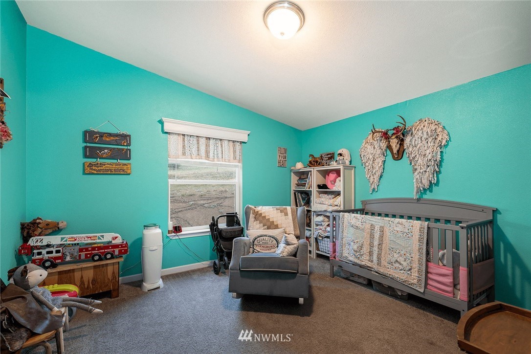 206 Senn Road Chehalis, WA 98532 - Photo 15 of 27 a bedroom with furniture and a window