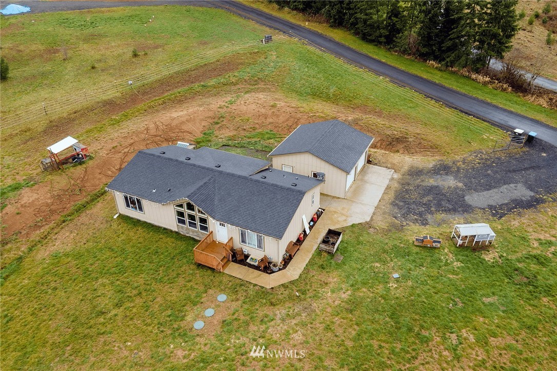 206 Senn Road Chehalis, WA 98532 - Photo 20 of 27 an aerial view of residential houses with outdoor space and swimming pool