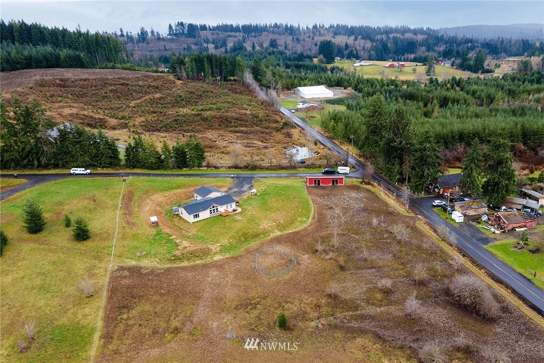 206 Senn Road Chehalis, WA 98532 - Photo 26 of 27 a view of a swimming pool and trees in the background