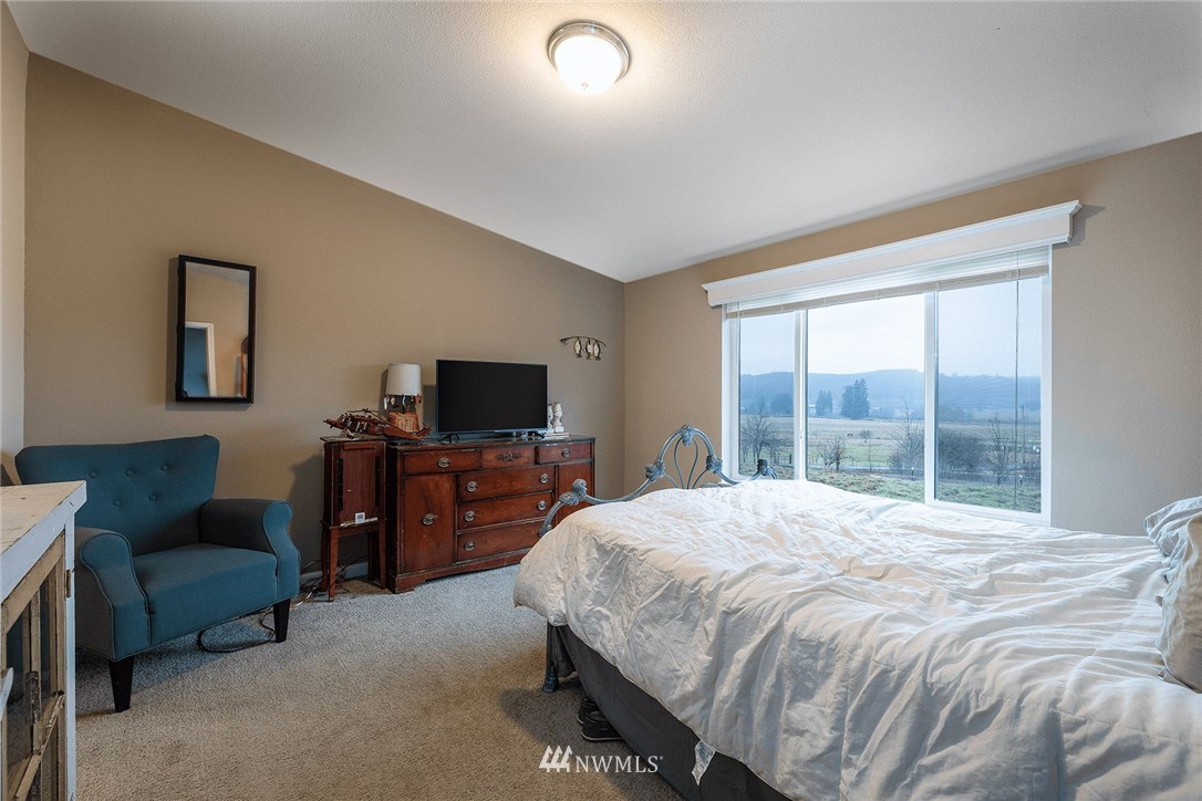 206 Senn Road Chehalis, WA 98532 - Photo 9 of 27 a bedroom with a bed and a television