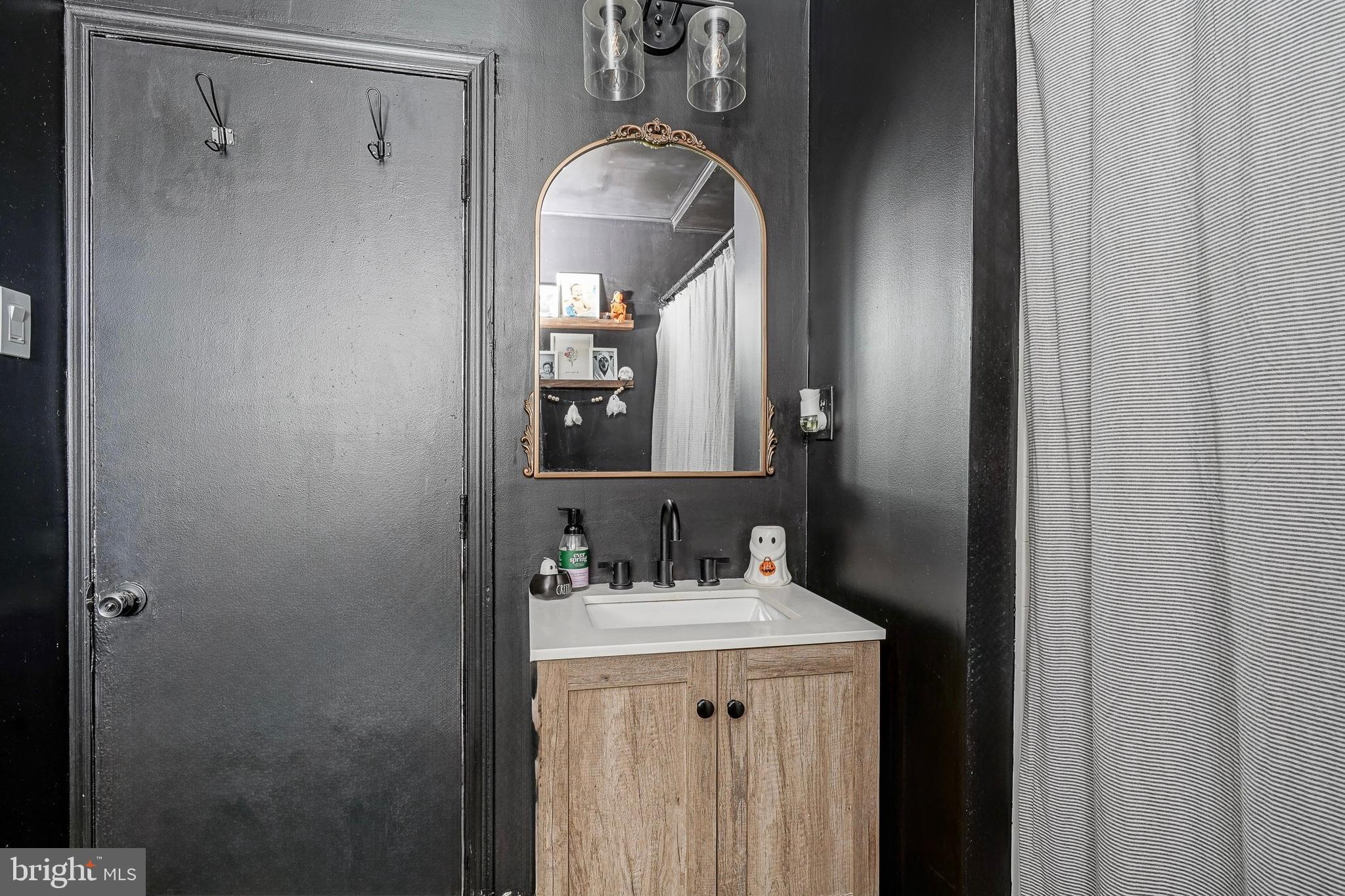 806 West Evesham Road Glendora, NJ 08029 - Photo 12 of 26 a bathroom with a sink vanity and a mirror