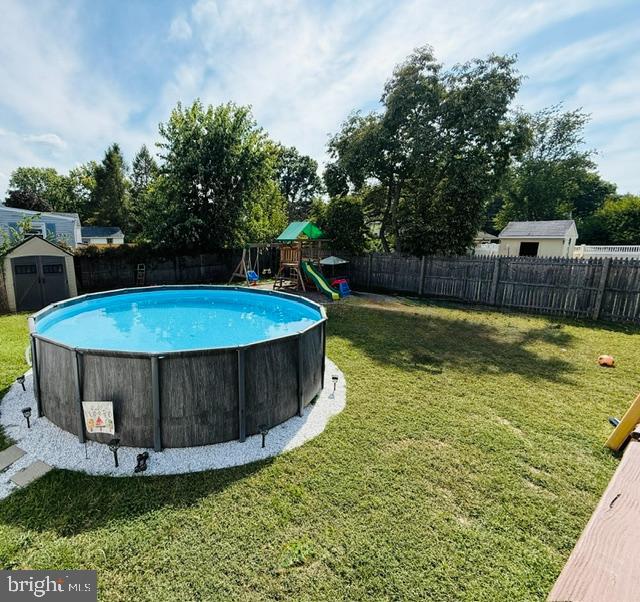 806 West Evesham Road Glendora, NJ 08029 - Photo 23 of 26 a view of a swimming pool with a patio and a yard